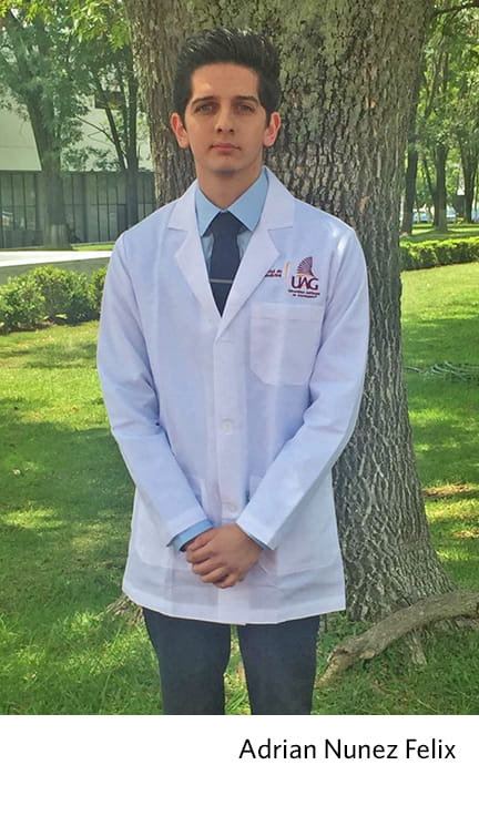 Adrian Nunez Felix poses in his white coat