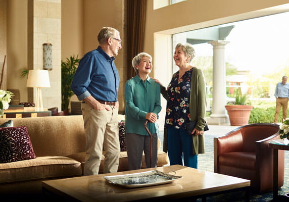 Residents socialize in the open-air lobby.